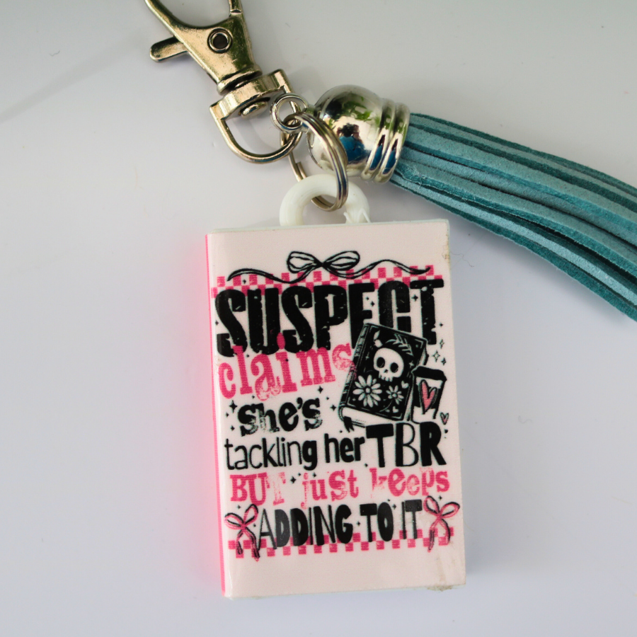 Suspect Book Keychain